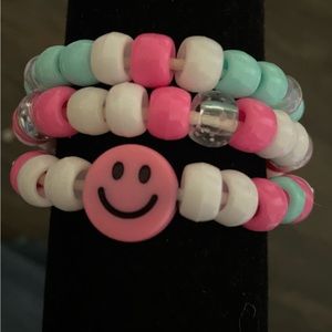 Bracelet set of three, hot pink and white themed.